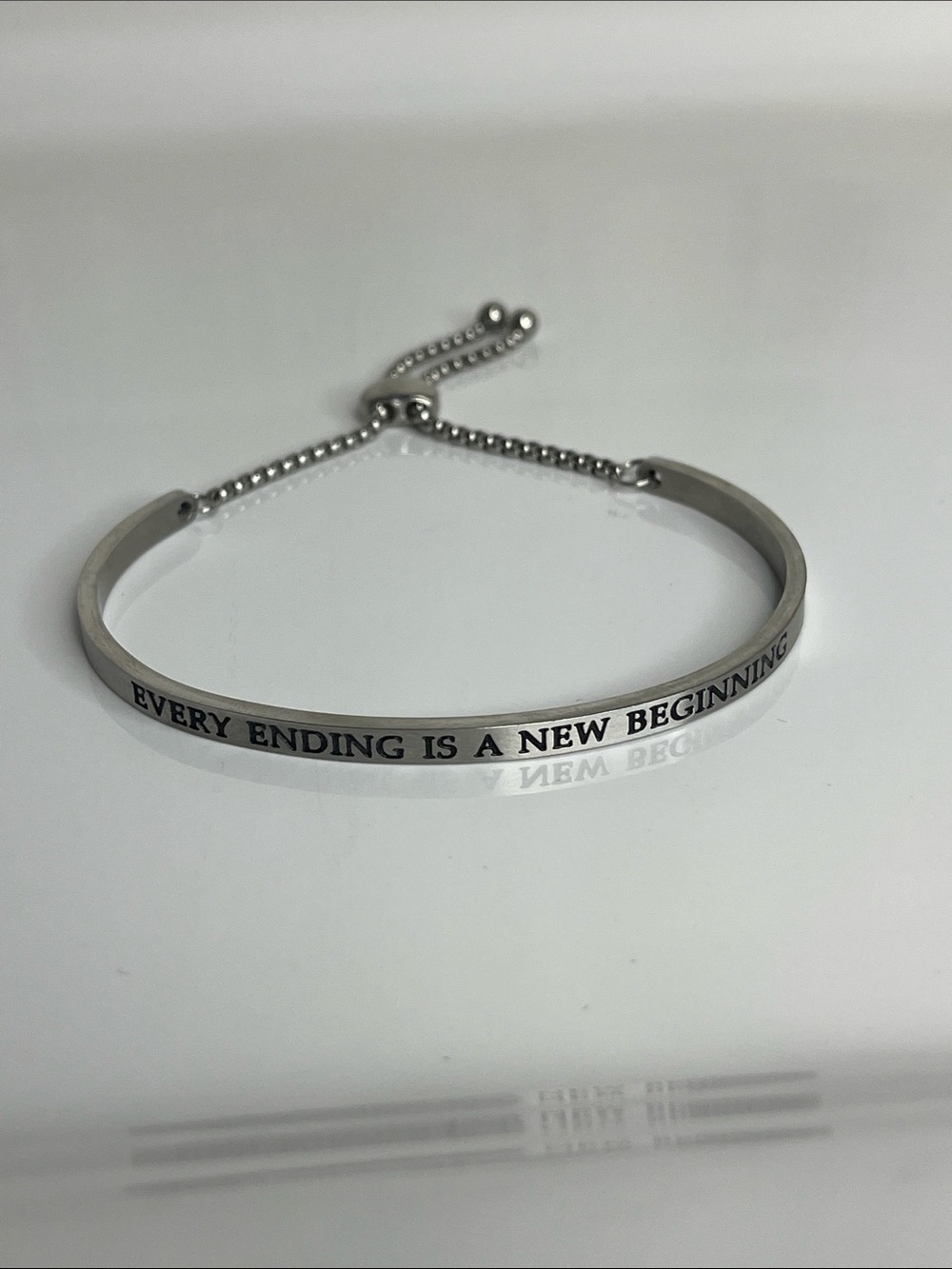Silver Inspirational Bangle Bracelet "Every Ending Is A New Beginning"